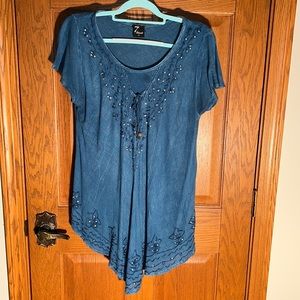 Rhinestones & embroidered decorate the front bodice & hem